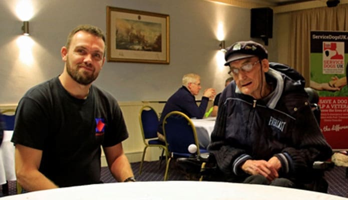 Army veteran volunteer Scott Key chats to a veteran service user at the VOS Drop-In