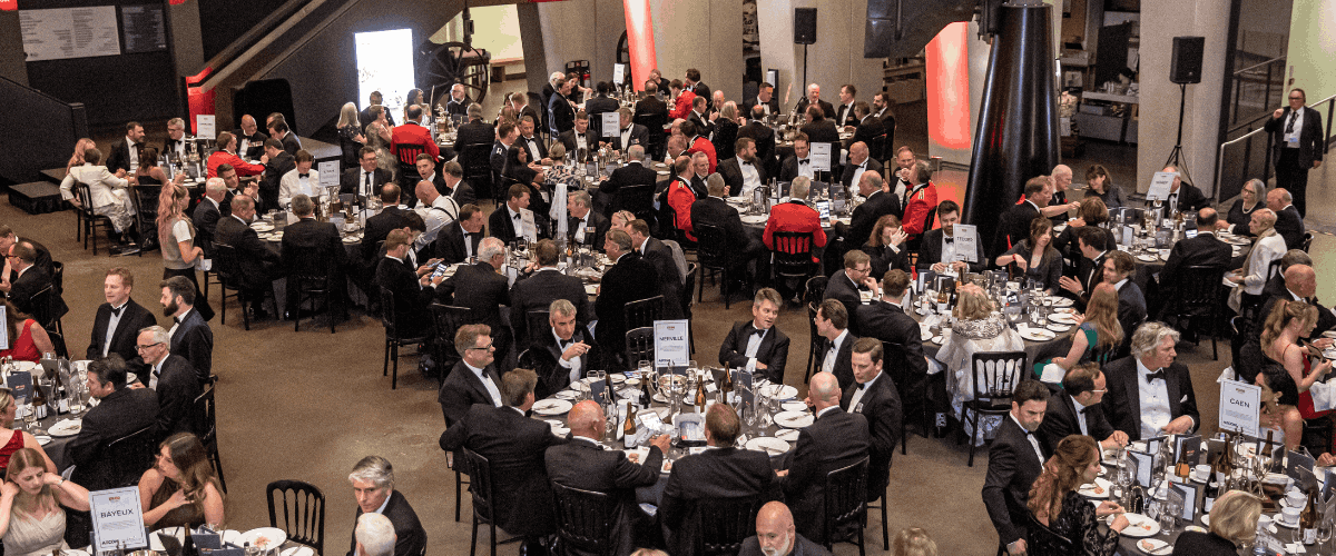 Several tables with guests at D-Day 80th anniversary dinner at Imperial War Museum