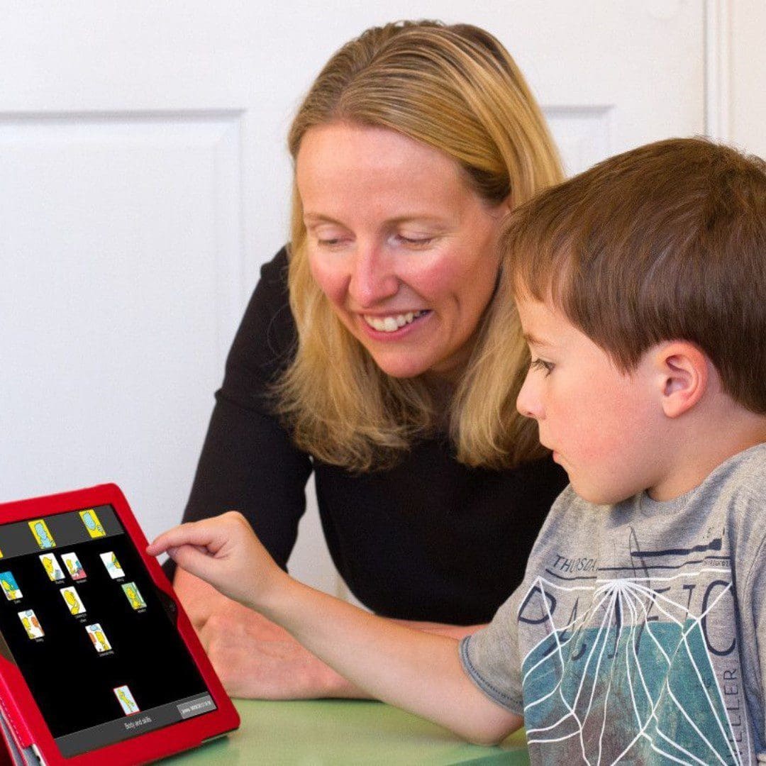 Adult woman and child who is using a tablet featuring a visual communications tool